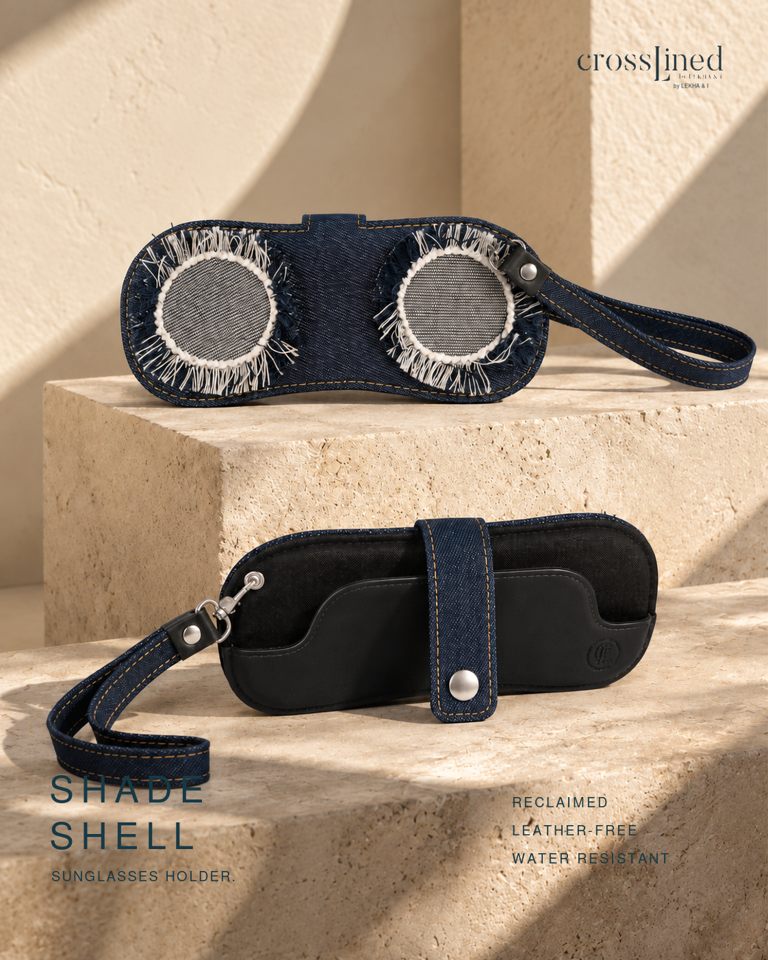 A pair of dark blue denim sunglasses holder cases shown in two views: one resting on a beige stone pedestal with circular mesh inserts, and another lying flat below with a strap closure. The brand name 'crossjined' appears in the top right, and 'SHADE SHELL SUNGLASSES HOLDER' is printed on the bottom left.