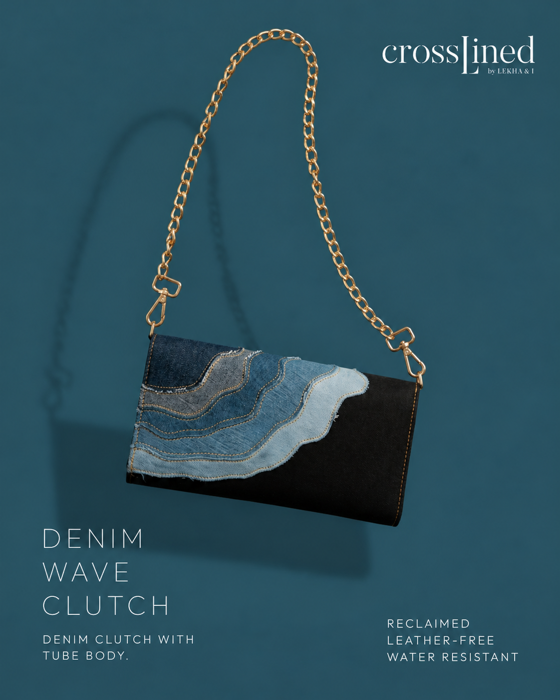 A Crosslined denim wave clutch with a gold chain strap, featuring a black leather-free body and a blue denim wave pattern, set against a dark teal background.