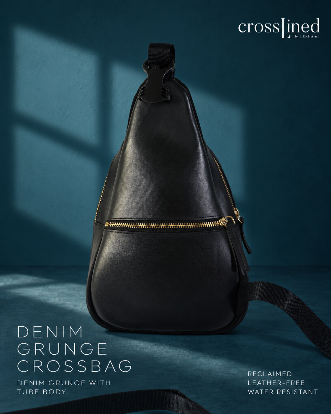 A black denim grunge crossbody bag with gold zippers, displayed against a dark teal-blue background with dramatic window shadows. The text 'crosslined by christy' is visible in the top right, and product details are listed on the bottom left and right.