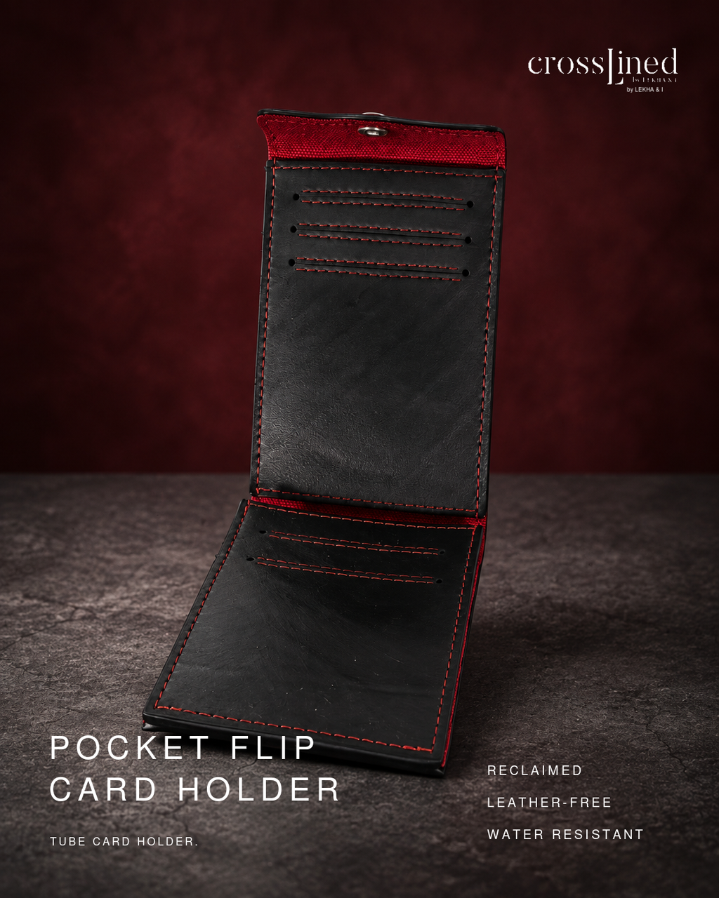 An open black leather-free pocket flip card holder with red stitching and red interior lining, displayed on a dark textured surface against a dark red background. Text on the image reads 'crosslined by christy' and 'POCKET FLIP CARD HOLDER'